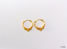 18kt gold hoop earring pair from rajasthan india. nice handmade design made of 18kt yellow gold, good for jewelry collection. Best gift item. Note - Please check pictures carefully for more details. Height - 2 cm Width - 1.65 cm Weight - 1.020 grams Material - 18kt yellow gold. Traditional Small Hoop Huggie Earrings For Gifts, Traditional Small Huggie Earrings As A Gift, Hallmarked Round Earrings For Puja, Traditional Gold Hoop Nose Rings, 22k Gold Hoop Jewelry For Festive Occasions, Gold Plated Round Hoop Earrings Temple Jewelry, Gold Plated Round Hoop Earrings In Temple Jewelry Style, Traditional Yellow Gold Huggie Earrings For Gift, Traditional Yellow Gold Huggie Earrings