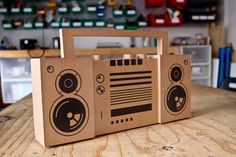 two brown bags with speakers on them sitting on a table