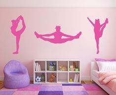 a bedroom with pink walls and purple carpeted flooring, two silhouettes of dancers on the wall