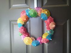 a wreath made out of umbrellas on the front door