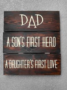 two wooden signs that say dad and son's first hero