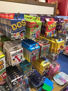 many different types of candy are on display in a store, including one for sale