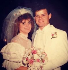 a bride and groom pose for a photo