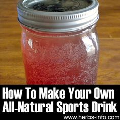 a mason jar filled with liquid sitting on top of a wooden table