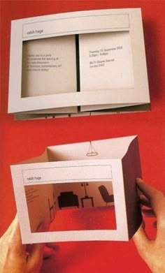 an open book with two pictures inside and one in the middle, on a red surface