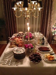 a table is set up with plates and food