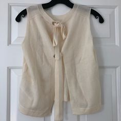 Brand New With Tags. Designer Size 1. Cream Colored. Spring Beige Cashmere Tops, Beige Cashmere Tops For Spring, Elegant Cream Cashmere Top, Chic Cashmere Tops For Daywear, Chic Cashmere Tops For Casual Wear, Chic Fine Knit Sweater Vest, Elegant Spring Sweater For Daywear, Chic Cashmere Knit Top, Chic Cream Sweater Vest For Spring