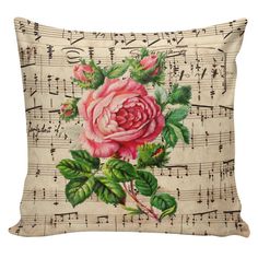 a pink rose on sheet music with green leaves is featured in this decorative pillow case