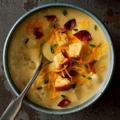 a bowl of soup with croutons and cheese