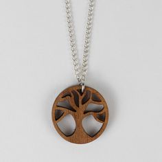 a necklace with a wooden tree on it