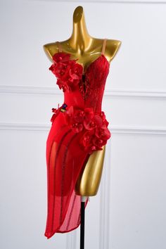 a mannequin wearing a red dress with flowers on it