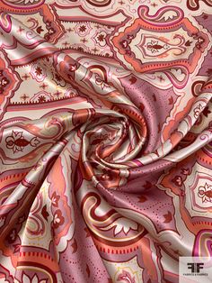 a pink and orange paisley print fabric