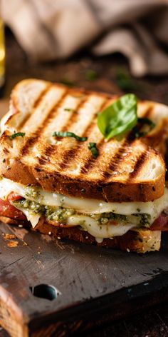 a grilled cheese sandwich on a cutting board