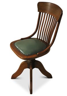 a wooden chair with green leather seat pad