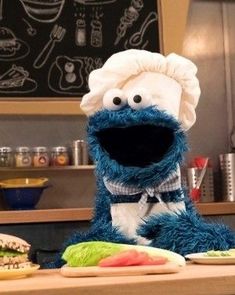 the sesame character is standing in front of some food