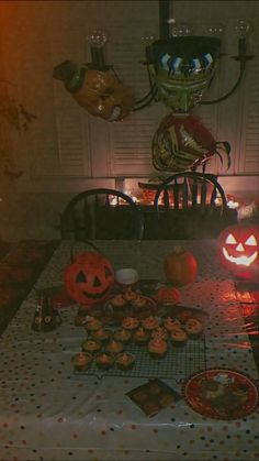 a table topped with lots of halloween treats