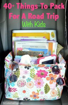 the back seat of a car filled with lots of things to pack for road trip