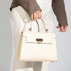 Layla Top-Handle Bag-Cream Luxury Business Flap Bag With Metal Hardware, Luxury Top Handle Box Bag For Daily Use, Traditional Top Handle Luxury Bag, Luxury Box Bag With Top Handle For Formal Occasions, Luxury High-end Box Bag With Detachable Handle, Luxury Top Handle Shoulder Bag With Case Included, Luxury Trendy Box Bag With Top Carry Handle, Luxury Modern Box Bag With Top Carry Handle, Luxury Large Box Bag With Handles