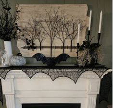 a mantle with candles and decorations on it