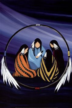 three women sitting in the middle of a circle with white feathers on their feet and one holding a baby