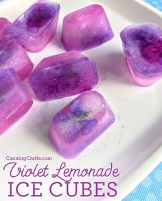 purple lemonade ice cubes on a white plate with text overlay that reads, violet lemonade ice cubes