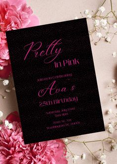 a pink and black birthday party with flowers