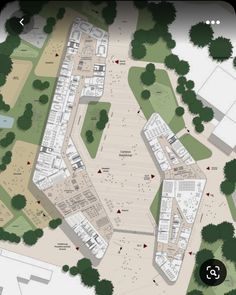 an aerial view of a parking lot with lots of trees