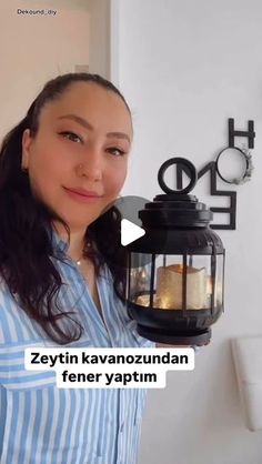 a woman holding a lantern in front of her face with the caption, zettin kavanoznandan fener yaptum