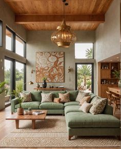 a living room filled with lots of furniture and large windows on top of the wall