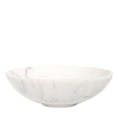 a white marble bowl sitting on top of a table