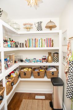 an organized pantry with lots of food in baskets on the shelves and bookshelves