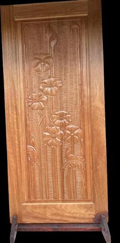 a wooden door with carvings on it