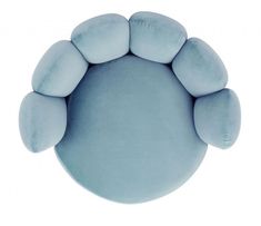 a blue round pillow with five pillows on the front and one is shaped like an animal's paw