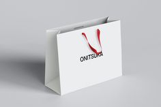 a white shopping bag with the word onitsuna printed on it's front