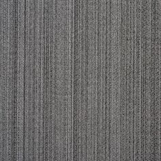 an overhead view of a gray carpet with vertical lines