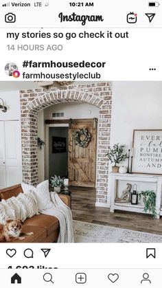 a living room filled with furniture and a wooden door in the middle of it's wall