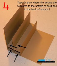 an open cardboard box with arrows pointing to the top and bottom, on a white surface