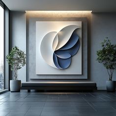 an abstract painting hangs on the wall next to two potted plants in front of a large window