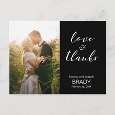 a black and white photo save the date card with an image of a couple kissing