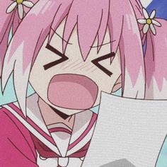 an anime character with pink hair holding a piece of paper and looking at the camera