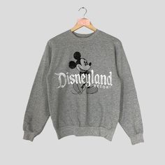 Vintage Rare DISNEYLAND Resort Crewneck Sweatshirt Big Logo DISNEYLAND Resort Jumper Pullover DISNEYLAND Resort Sweater Grey Colour Unisex CONDITION :- ✅GOODUSED CONDITION. ✅HAVE STAINS  ✅HAVE HOLE ITEM DESCRIPTION:- ✅SIZE: - ✅MATERIAL : COTTON ✅THIS USED & VINTAGE ITEMS, SO DON'T EXPECTED IT TO BE LIKE NEW CONDITION!! MEASUREMENT:- ✅ARMPIT TO ARMPIT : 20 INCH ✅LENGHT BACK COLOR/NECK TO HEM : 26 INCH ✅SHOUDLER : 20 INCH ✅SLEEVE LENGTH: 23.5 INCH PLEASE REFER PHOTO BEFORE ORDER ALL MEASUREMENTS ARE TAKEN WITH THE GARMENT FLAT ON THE GROUND THE PARCEL WILL BE ARRIVE WITHIN 10-14 DAYS WORKING DAYS OR MORE DUE TO THE LOCATION & CUSTOMS CLEARINGS. BUYER DON'T HESITATE TO ASK ME IF ANY INQUIRY ABOUT ITEM BEFORE PURCHASING. PLEASE BEWARE THESE ARE VINTAGE ITEM. PLEASE CAREFULLY CHECK THE ITEM MEA Retro Gray Long Sleeve Tops, Retro Gray Crew Neck Top, Gray Retro Crew Neck Top, Vintage Gray Crew Neck Sweater, Disneyland Parks, Sweater Grey, Grey Colour, Disneyland Resort, Grey Sweater