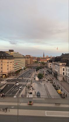 an aerial view of a city street in the evening