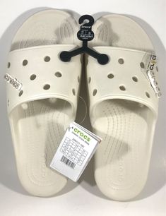 CROCS  Classic Crocs Slide  Comes with "Crocs" logo Jibbitz Attached to Each Slide Style # 206121-160 Unisex  Men's Size 11 (M11) Beige Brand New with Tags and Store Display Hanger Attached Photos were taken by me and show the exact item you will receive Please make sure this is the size you need.  All Sales Are FINAL I'm available to answer any questions you may have! QUICK SHIPPING!  CAREFULLY PACKED IN A BOX! The shipping cost listed above was automatically calculated by the Post Office's ACTUAL cost to ship this package’s weight to your zip code on file with eBay.  I pack them with care in a box, not an envelope to avoid arriving damaged. Customize Crocs, Crocs Classic Slide, Crocs Logo, Crocs Slides, Classic Crocs, Mens Shoes Sandals, Store Display, Zip Code, In A Box