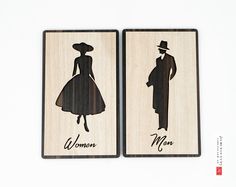 two wooden cards with the silhouettes of women and men