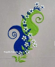 a blue and green design with white flowers