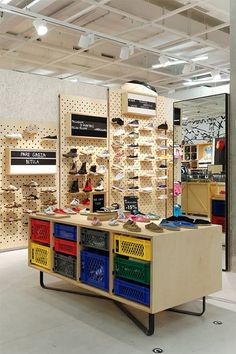 the inside of a shoe store with lots of shoes on display