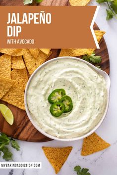 jalapeno dip with avocado in a bowl surrounded by tortilla chips