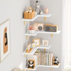 a white shelf filled with books and stuffed animals