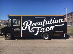 a black food truck with the word revolution taco painted on it's side