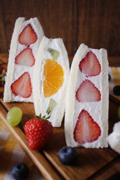 some fruit is cut into pieces on a wooden tray